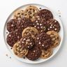 A plate of golden and chocolate choc chip cookies, mixed